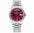 Rolex Day Date watch with a silver stainless steel Oyster bracelet, fluted bezel, and a deep burgundy-red dial with a day and date window.